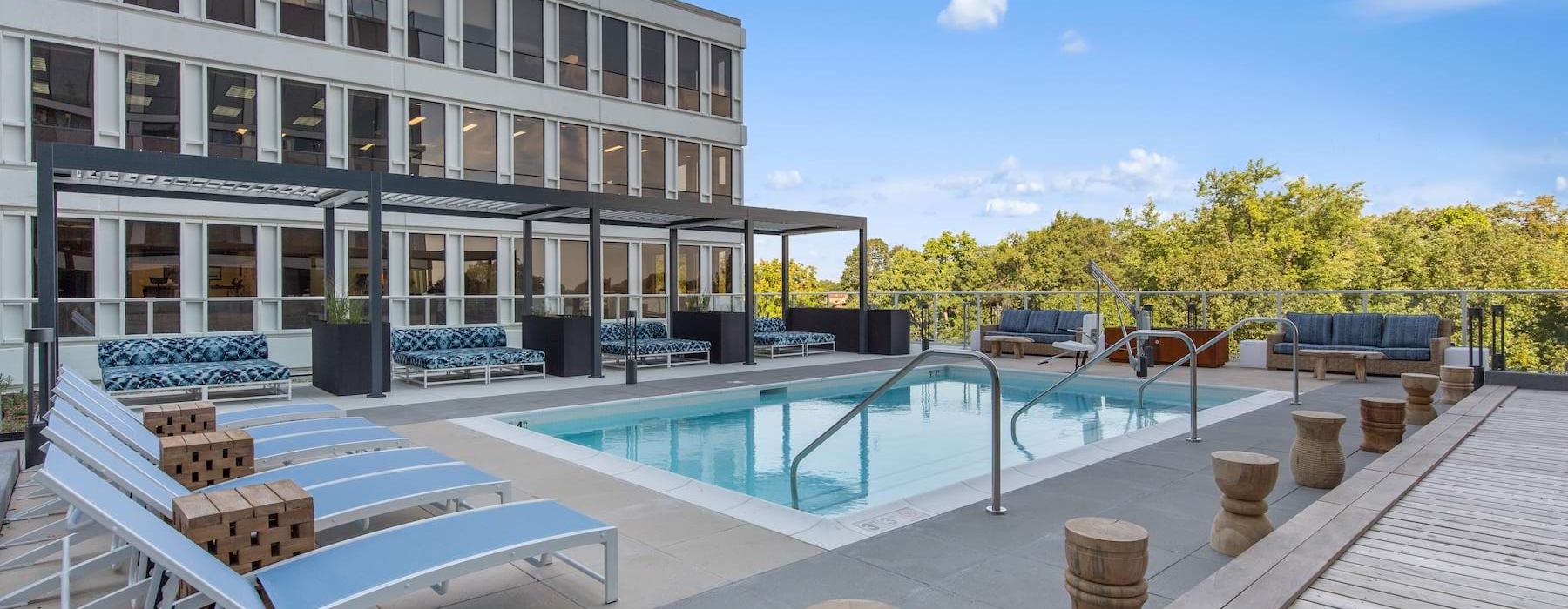 a swimming pool with lounge chairs