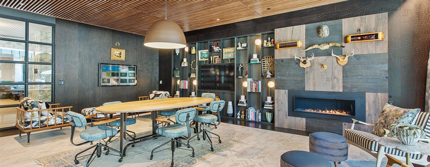 a room with a fireplace and chairs
