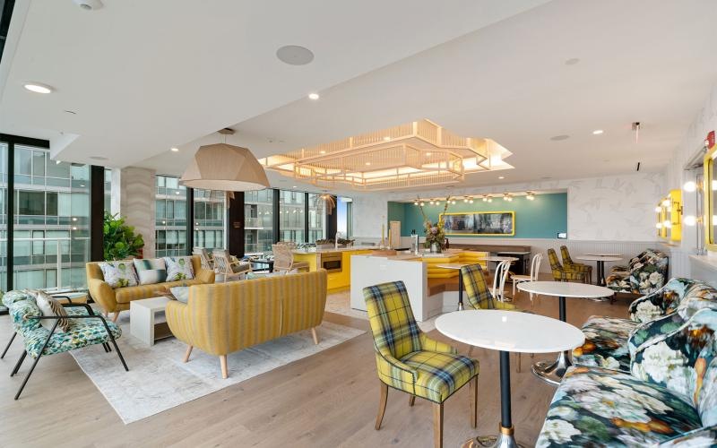 a room with a large table and chairs